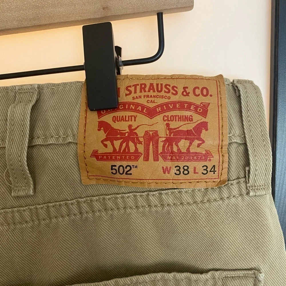 Levi's 502 tan pants. Size 36. HEMMED‎
